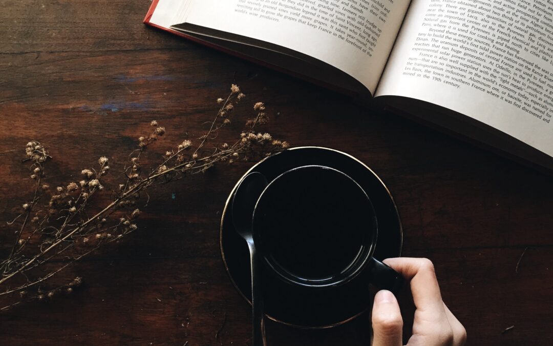 picture of open book with coffee cup